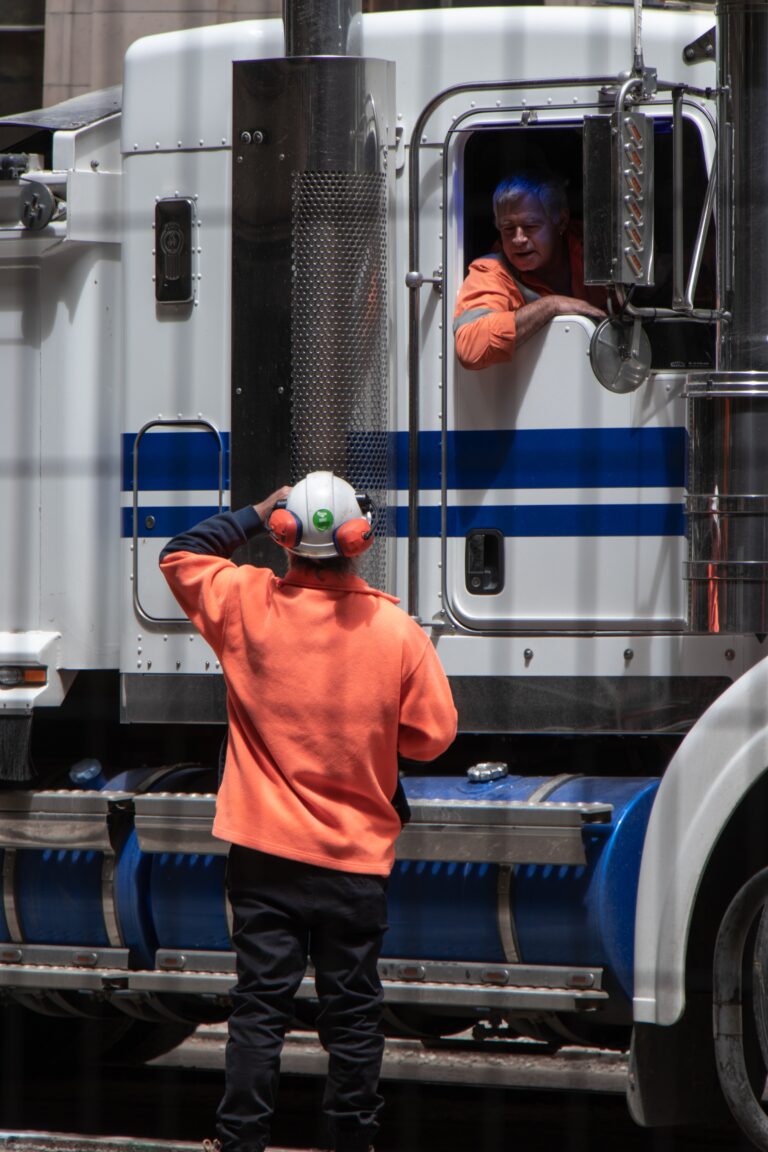 A driver and support personnel for a Semi Truck